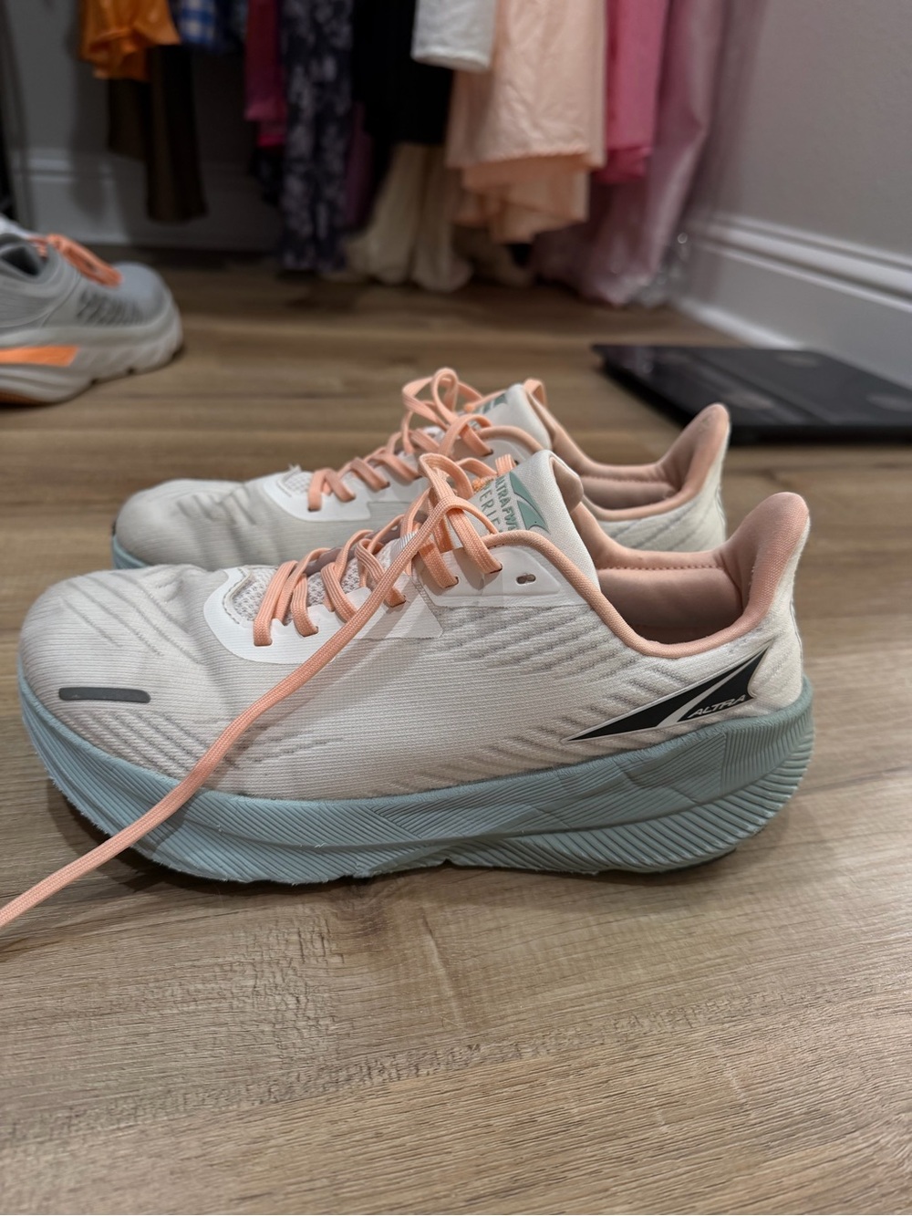 Altra Women's White Running Shoes with Peach Laces and Light Blue Midsole